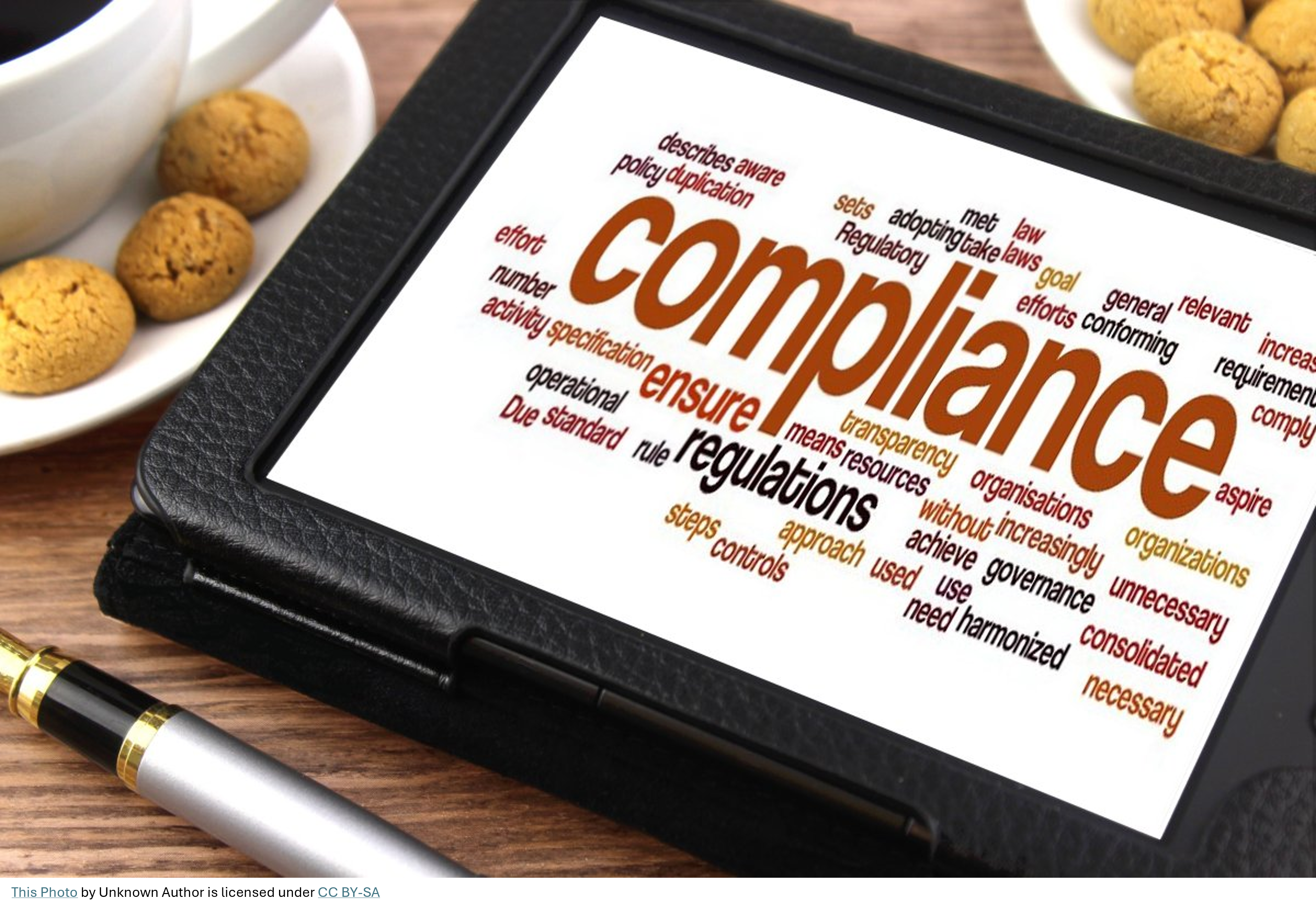 tablet showing wordcloud for compliance